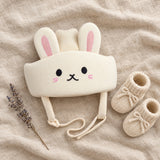 Soft Landing Cap flat lay with booties